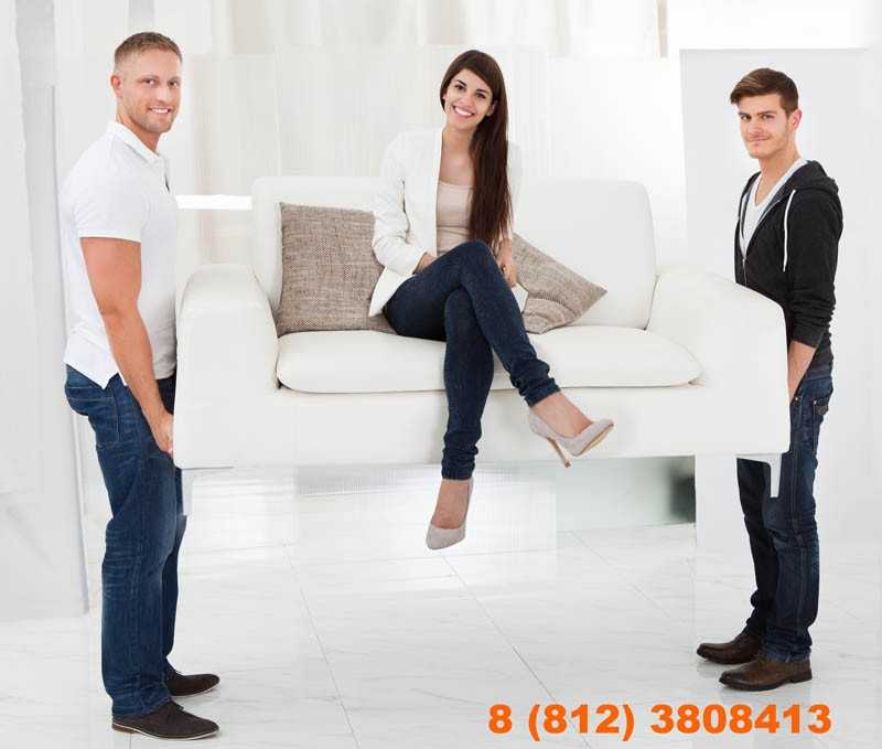 Movers Carrying Sofa With Client